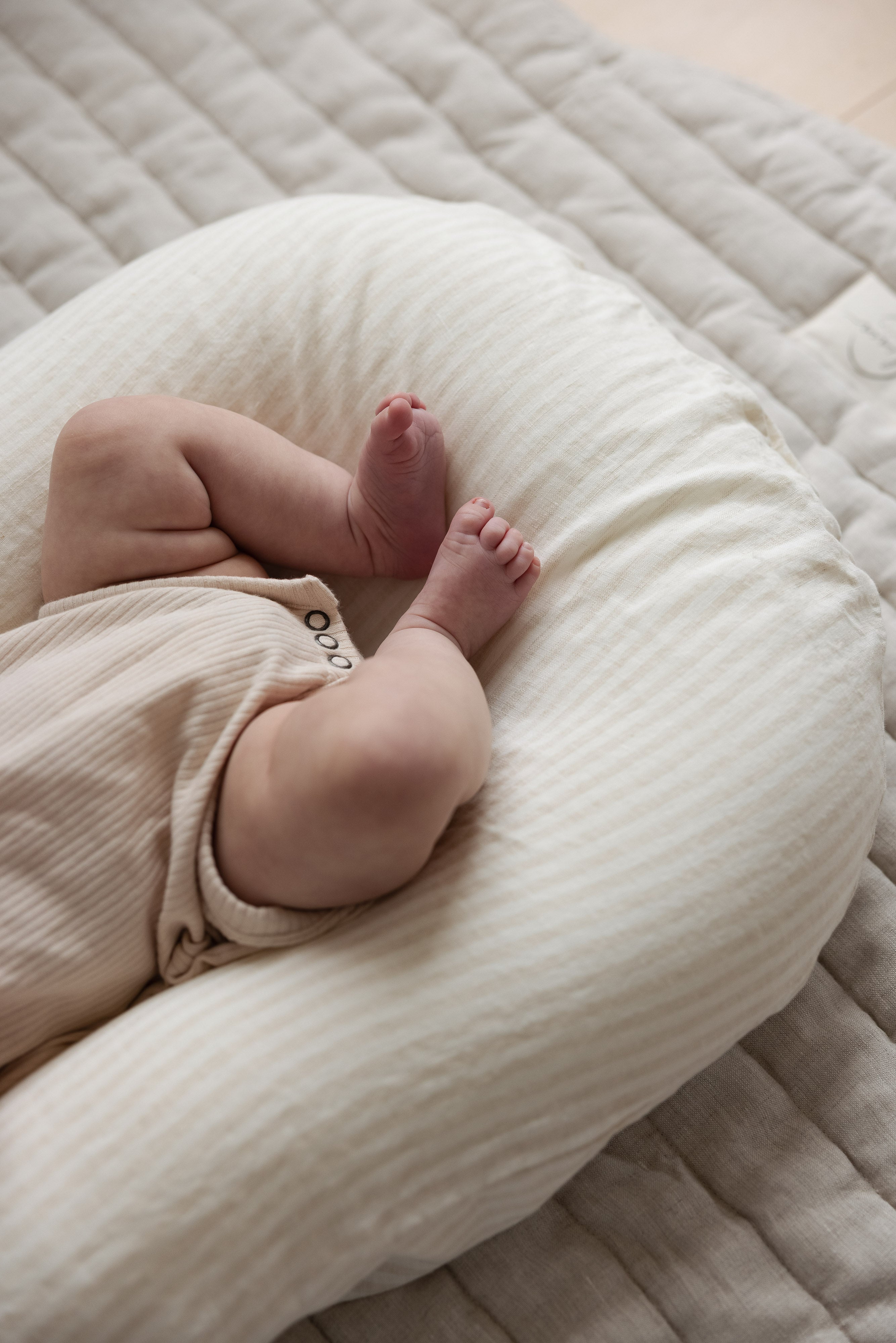 Linen Label baby lounger featuring the baby pink pure linen flax cover