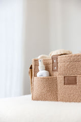 Linen Label tan caddy showing front pocket detail with baby bottom cream