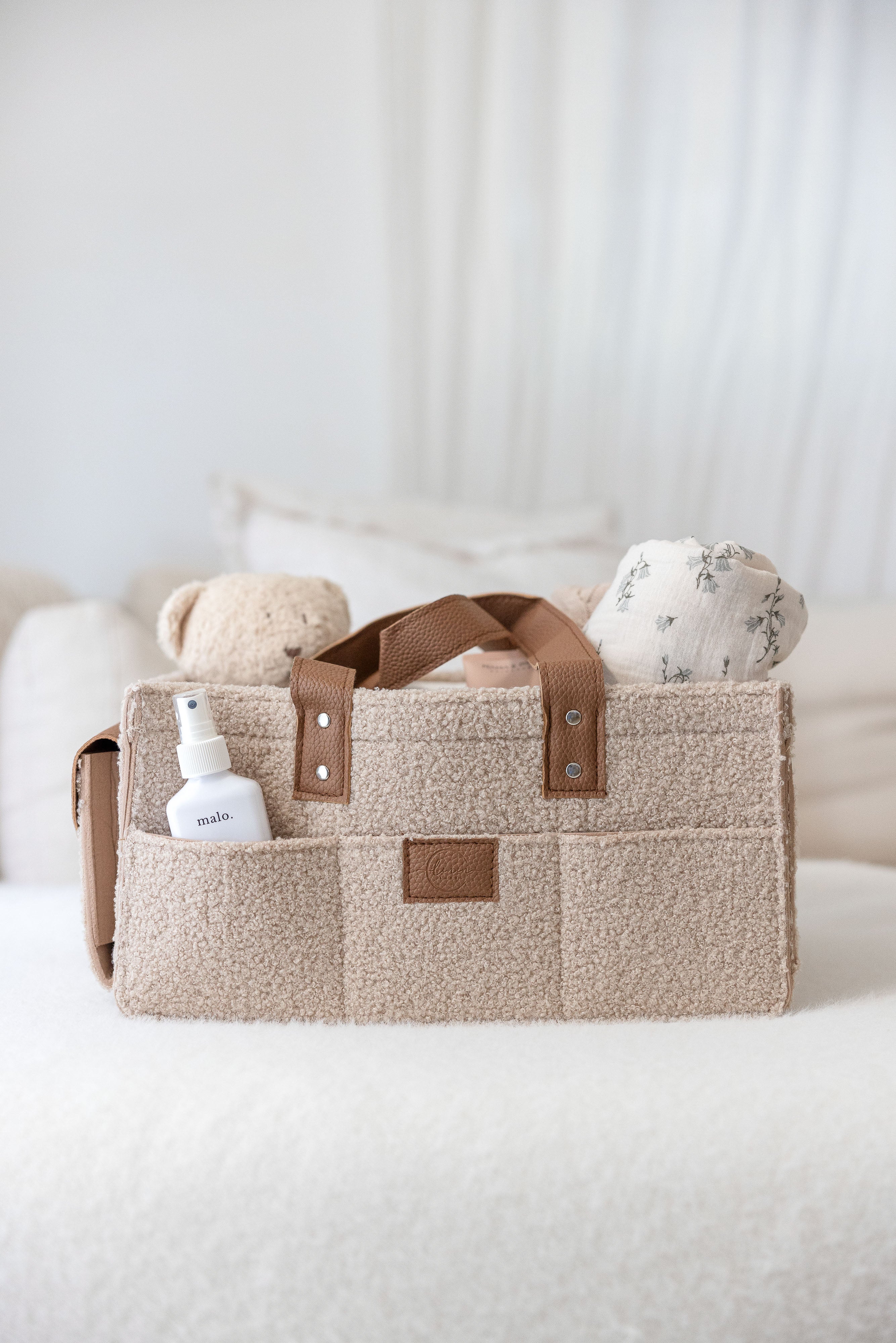 linen label caddy in dark dude colour. showing detail of the pockets