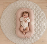 baby nest with French Linen Cover, providing a lightweight, breathable, and hypoallergenic sanctuary for your little one. pair back with our quilted baby play mat