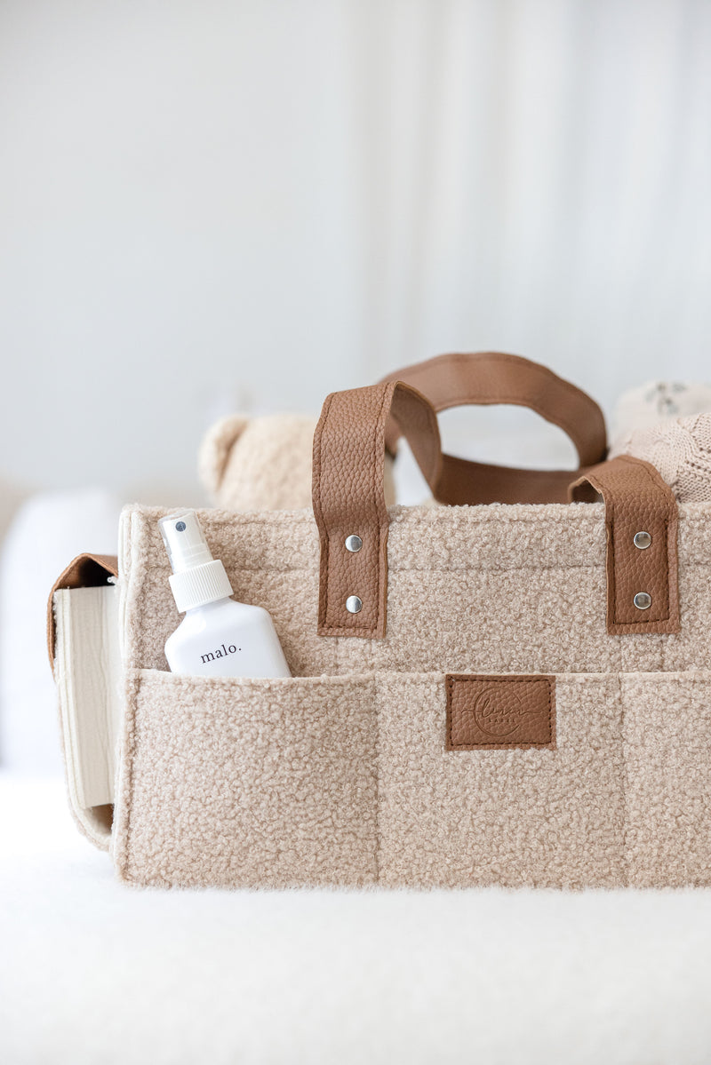 linen label caddy in dark dude colour. showing detail of all functioning pockets