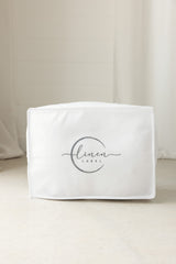 Showing the free dust cover bag that all out pillows come in with linen label logo featured on the front 