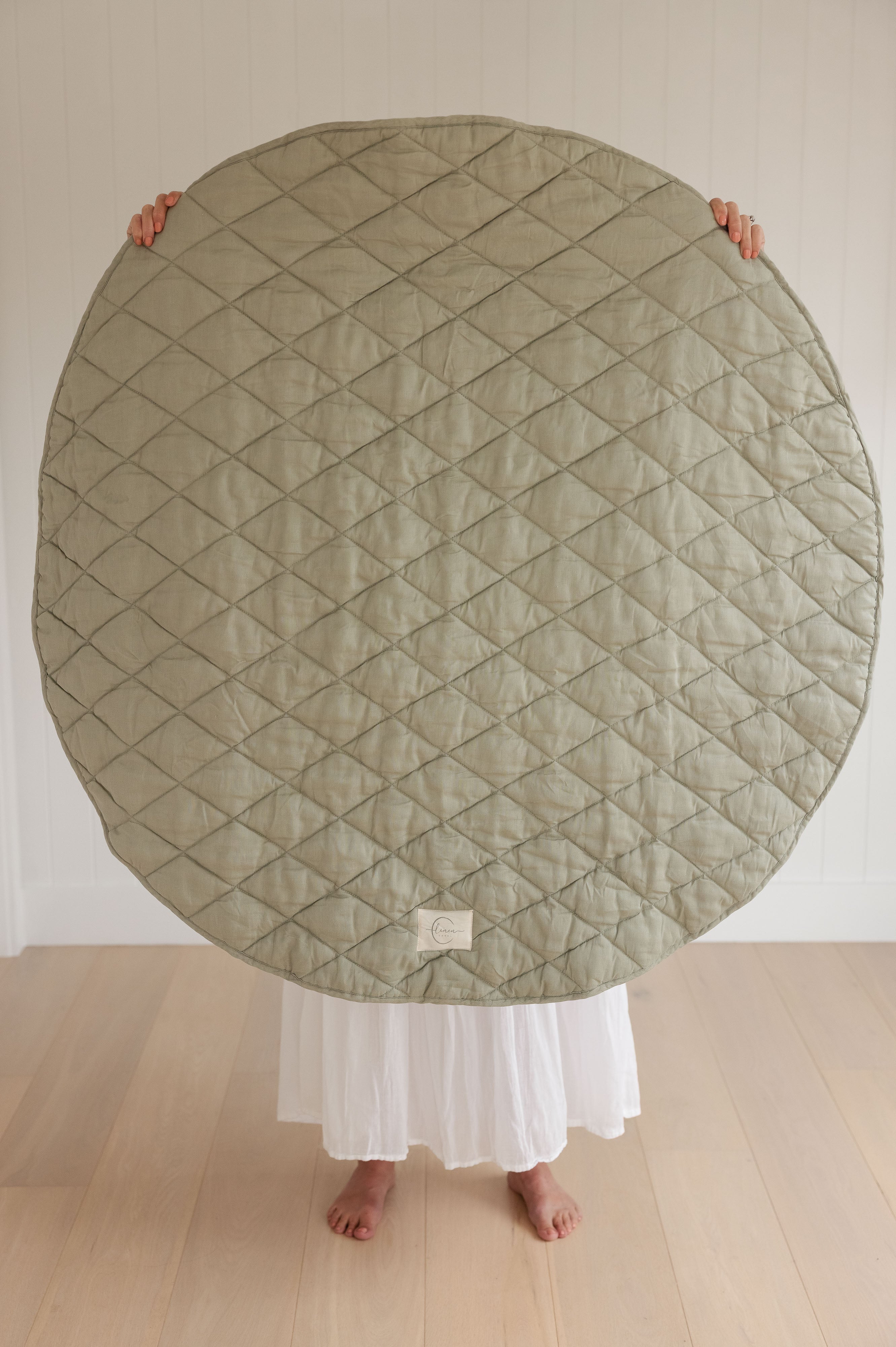 Showing the size of the French Linen quilted padded play mat. with logo showing on the front side