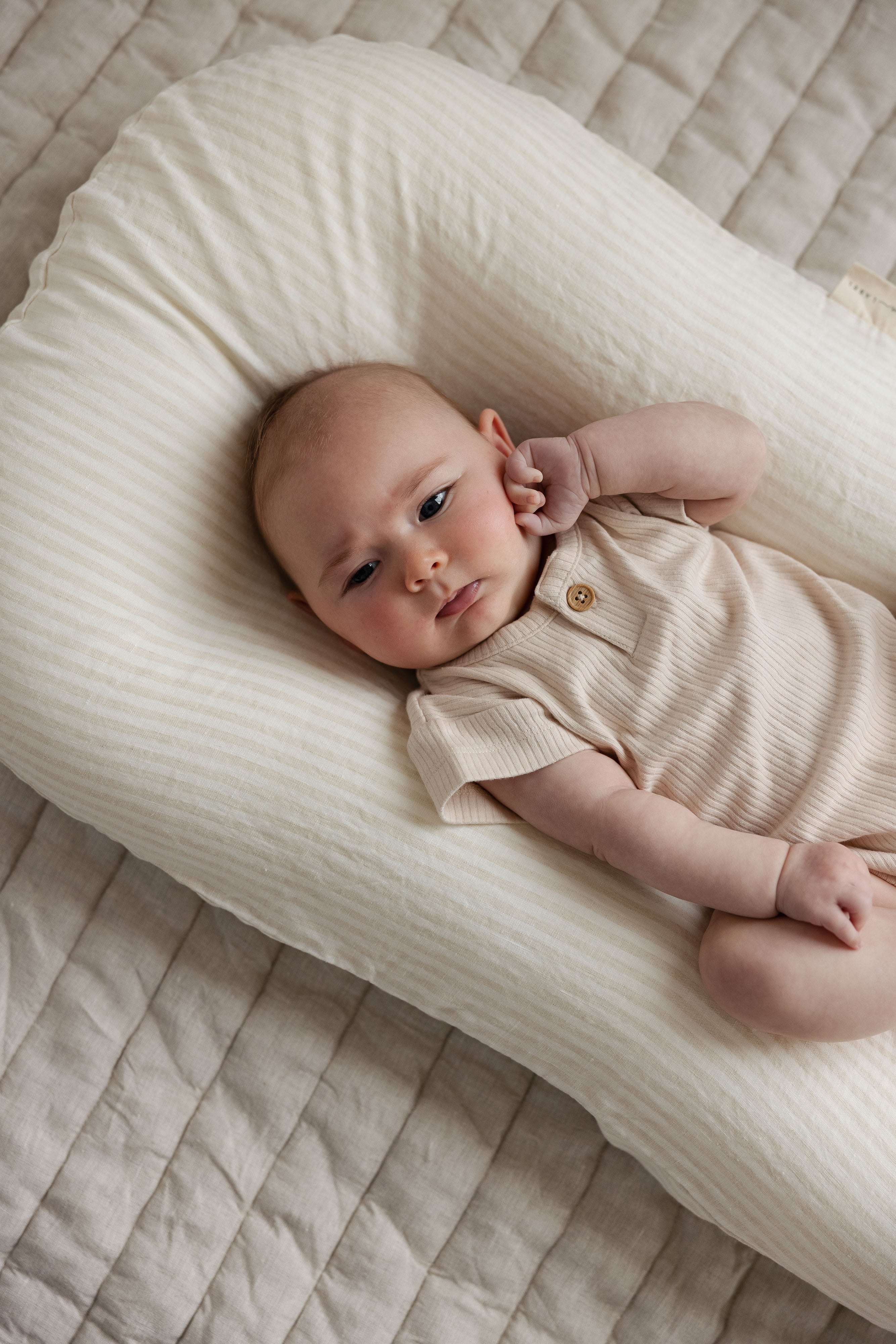 Linen Label baby lounger featuring the baby pink pure linen flax cover