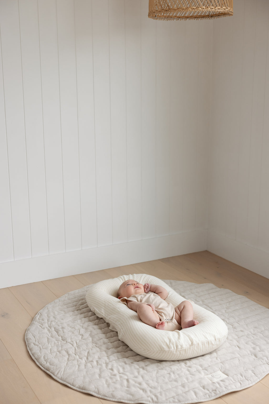 Linen Label baby lounger featuring the baby pink pure linen flax cover