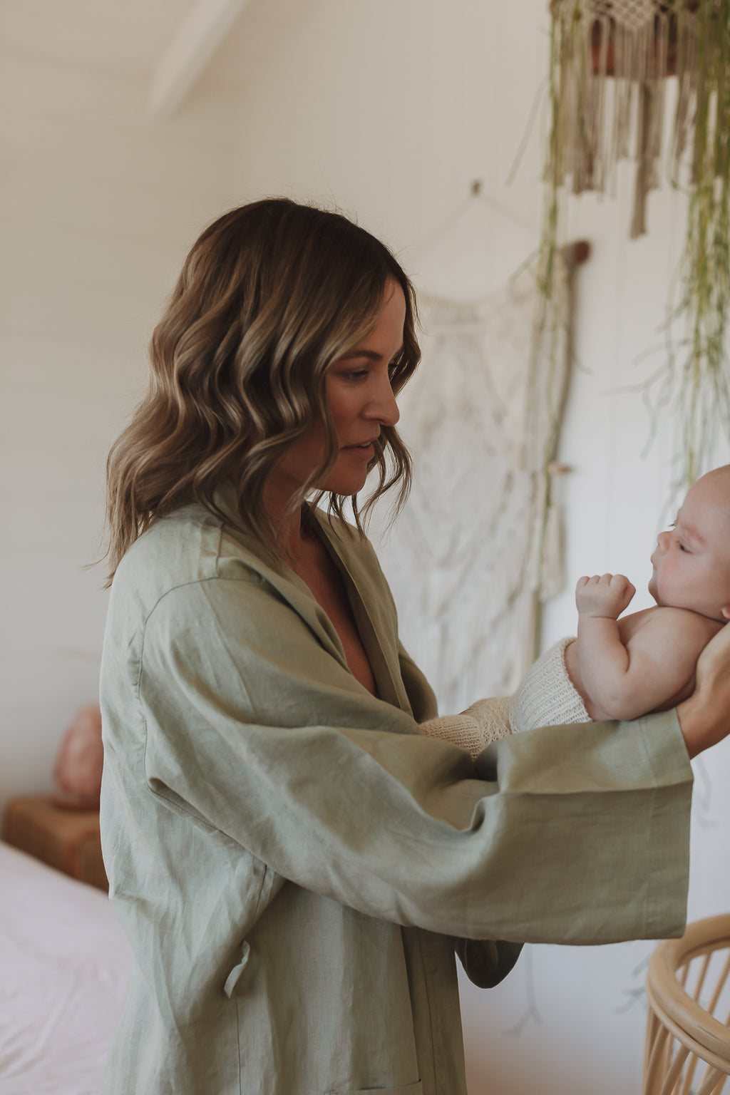 the baby has woken early and the mother only has time to grab her Label Soft Sage Green French Linen Bathrobe Kimono Robe. looking stylish and comfortable around the home. Showing Linen Label Robes are perfect for ultimate comfort and relaxation. Crafted with 100% French Linen that grows softer with each wash